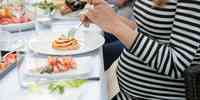 

woman eating seafood