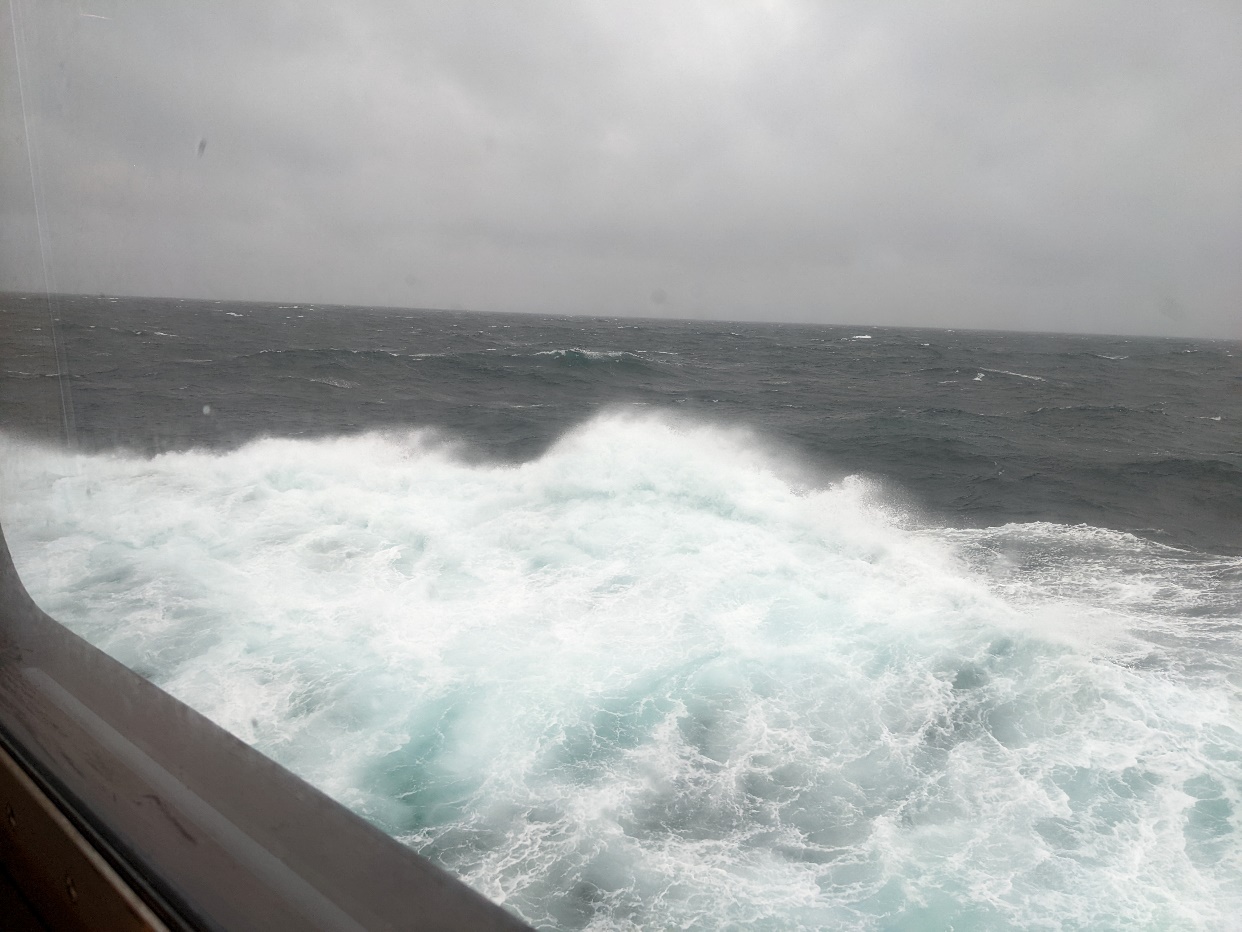 Photo of bad weather the boat crashing through waves that are blowing int spray the wind